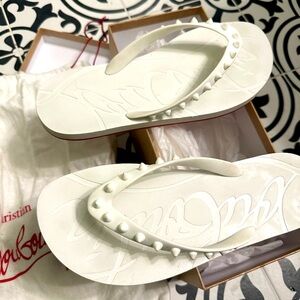 Christian LouBoutin white flip flop, size 40, fits like a 9.